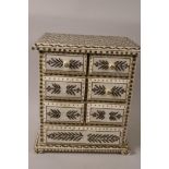 An Oriental painted faux bone jewellery chest of seven drawers, 11½" x 10" x 6½"