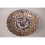 A C19th Imari porcelain bowl with frilled rim decorated in the tradititional palette, 11½" dia