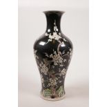 A Chinese famille noire porcelain vase decorated with a prunus tree in blossom, 6 character mark
