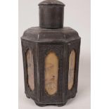 A Japanese antimony tea caddy of octagonal form, with glazed panels of domestic scenes, 7½" high