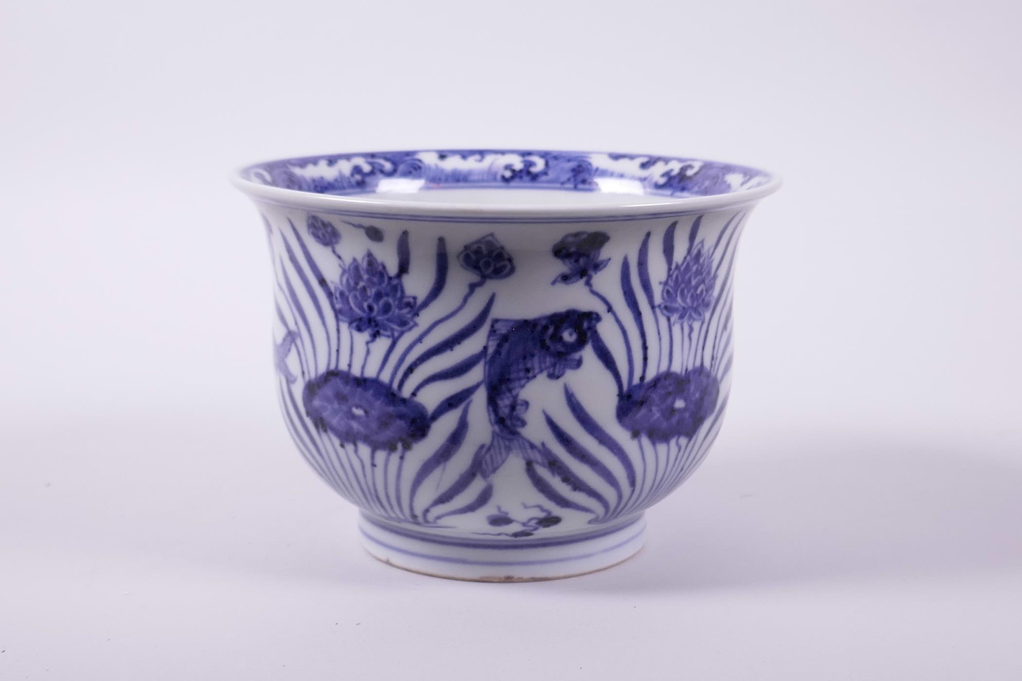 A Chinese blue and white porcelain steep sided bowl decorated with carp in a lotus pond, 4" high x - Image 3 of 7