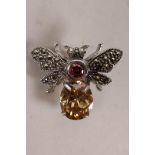 A 925 silver brooch in the form of a bee set with marcasite and citrine, 1"