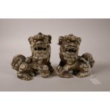 A pair of ceramic kylin, with pearls in their mouths, 6" high