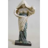 A glazed terracotta figure of a woman in a cloak, 24" high