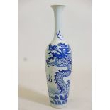 An Oriental blue and white porcelain vase with dragon decoration, signature to base, 21" high