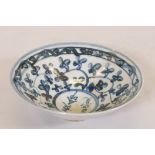 An Oriental ceramic bowl, with blue and white decoration and inscription, 7" diameter