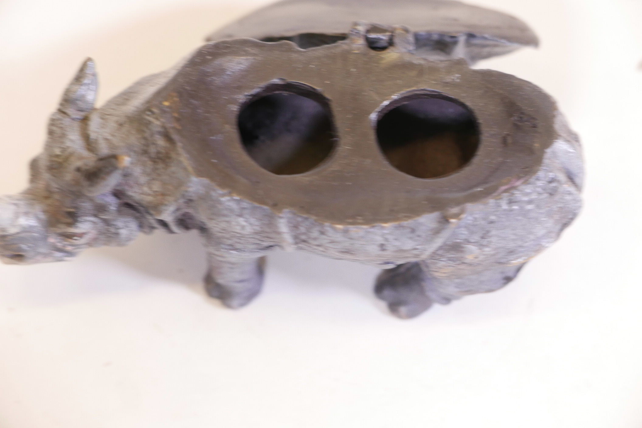 A cold painted bronze inkwell in the form of a rhinoceros, fitted with two wells, lacking liners, - Image 2 of 3
