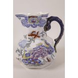 A Mason's Patent Ironstone jug of octagonal form with serpent handle and decorated with flowers