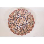 A large Imari porcelain charger with bird and scroll decoration in the traditional palette, 15"