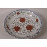 A Chinese porcelain shallow bowl painted with scrolling flowers, 6 character mark to base, 12"