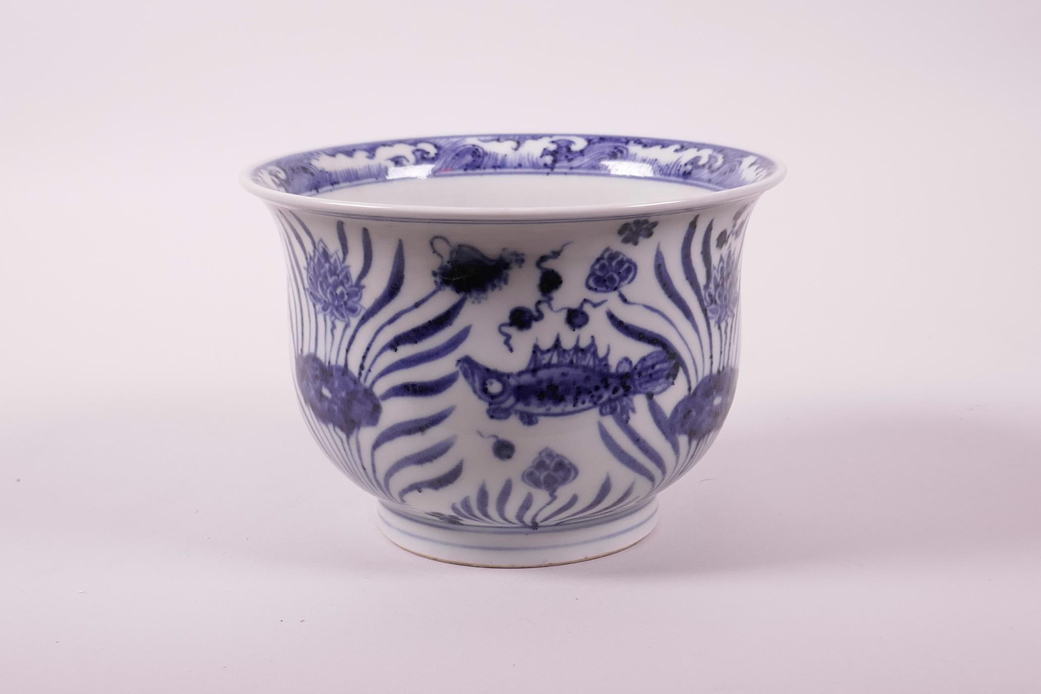 A Chinese blue and white porcelain steep sided bowl decorated with carp in a lotus pond, 4" high x - Image 4 of 7