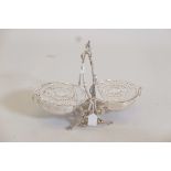 A silver plated muffin dish with pierced, hinged covers, 11" high