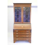 A late Victorian satinwood inlaid mahogany fall front bureau bookcase, with astragal glazed upper