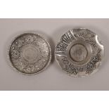 A Chinese white metal coin dish, and another similar dish, largest 4½" diameter