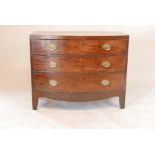 An early C19th mahogany bowfront chest of three long drawers, raised on shaped supports, 21" x 43" x