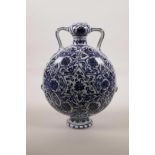 A Chinese blue and white porcelain two handled flask decorated with lotus flower pattern, 11" high