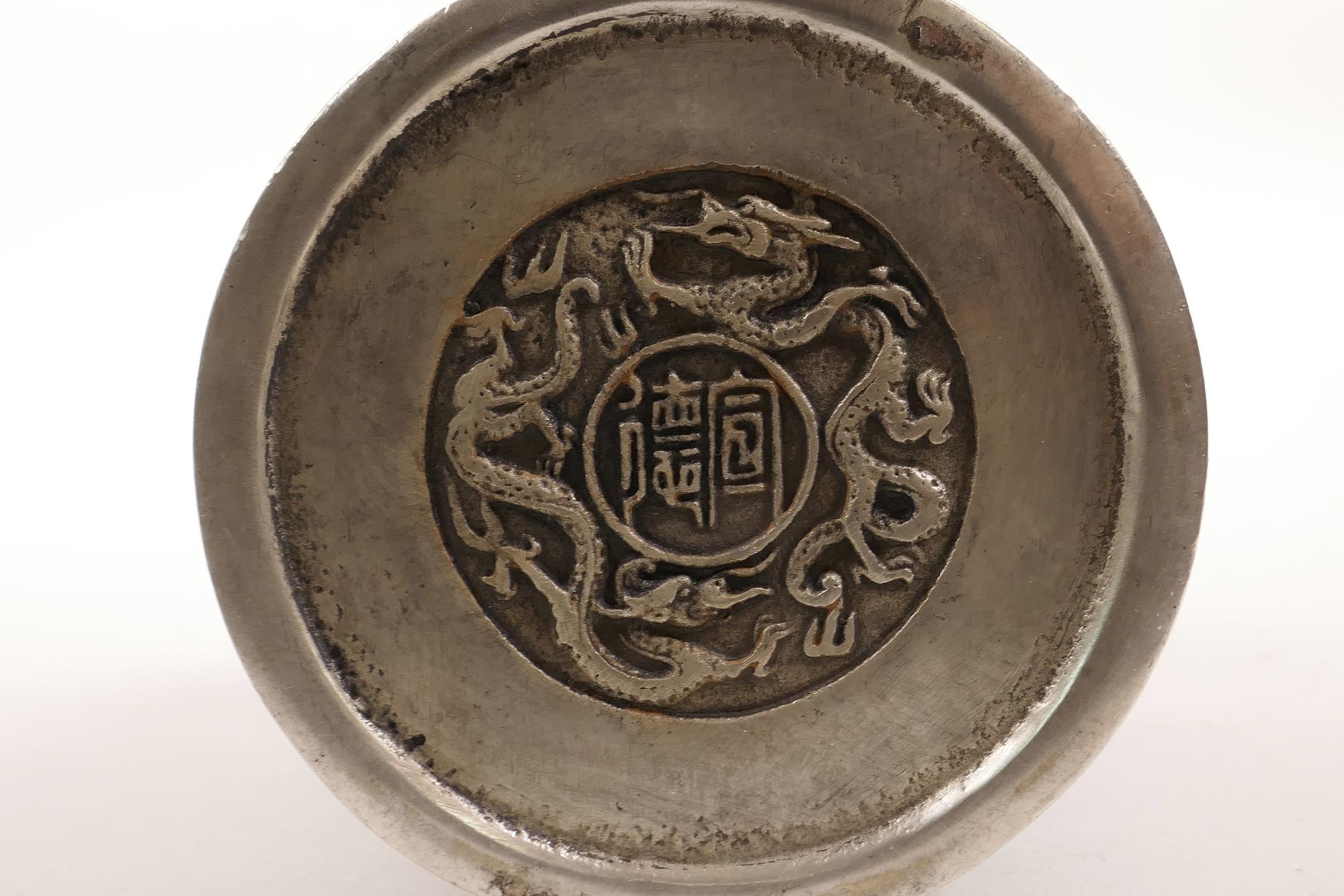 A Chinese white metal brush pot decorated with the emblems of the Eight Immortals, impressed mark to - Image 5 of 5