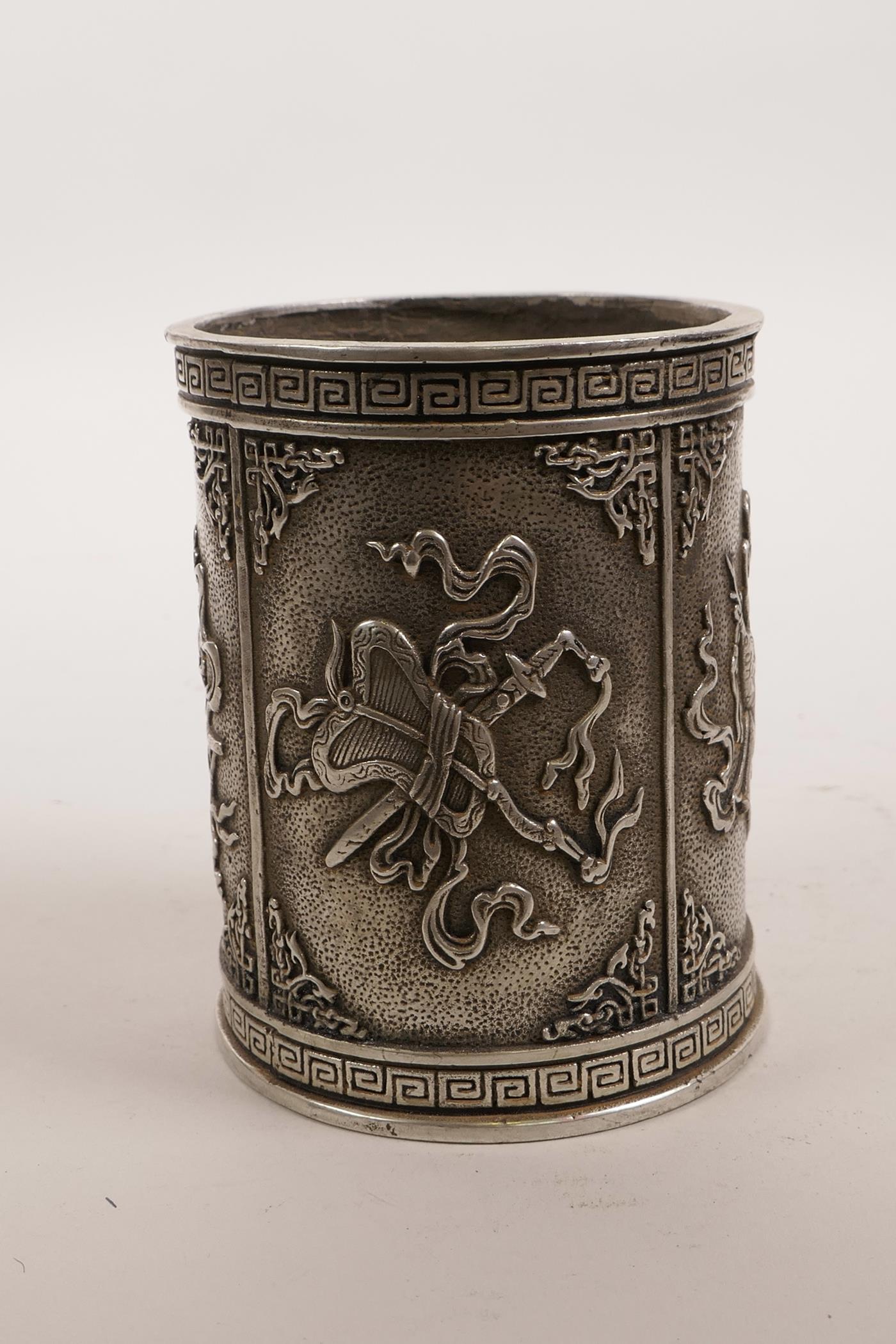 A Chinese white metal brush pot decorated with the emblems of the Eight Immortals, impressed mark to - Image 2 of 5