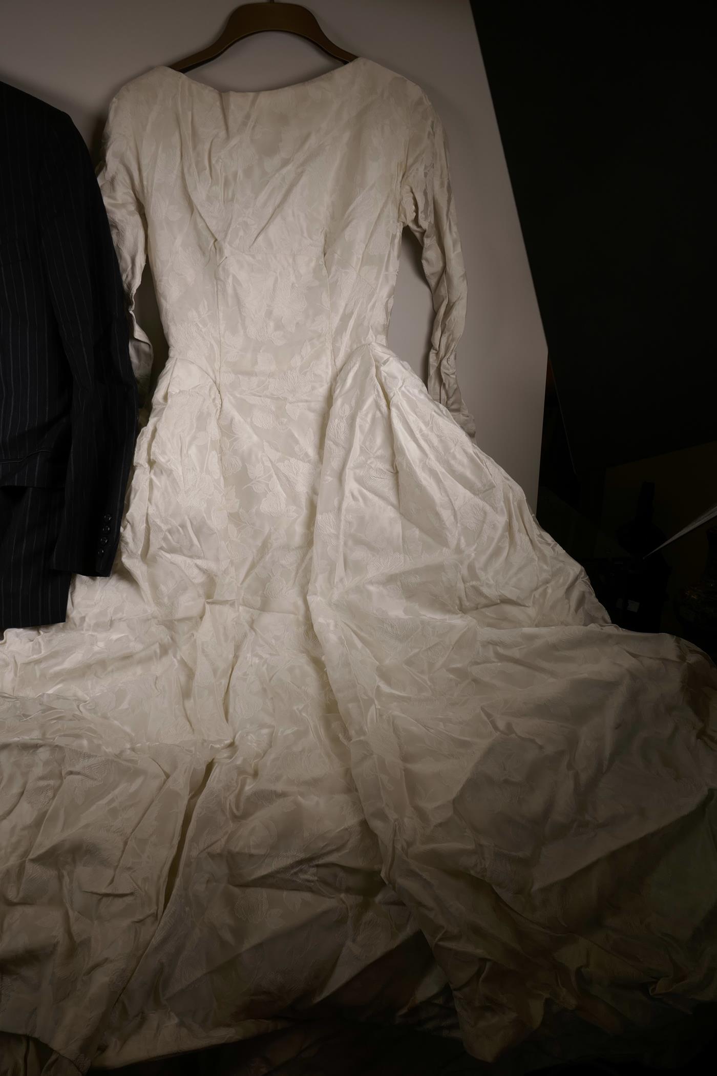 A white satin wedding dress from Marshall and Snelgrove, and a Christian Dior blue pin striped suit - Image 2 of 3