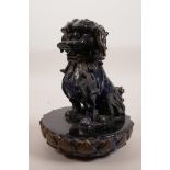 A Chinese blue glazed ceramic figure of a fo dog, tail A/F, 8½" high