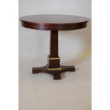 A mahogany centre table, raised on tapering column with platform base with parcel gilt decoration,