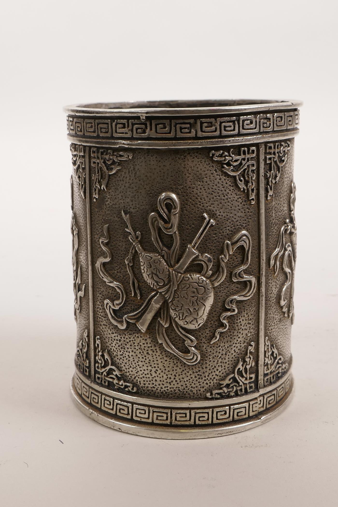 A Chinese white metal brush pot decorated with the emblems of the Eight Immortals, impressed mark to - Image 3 of 5