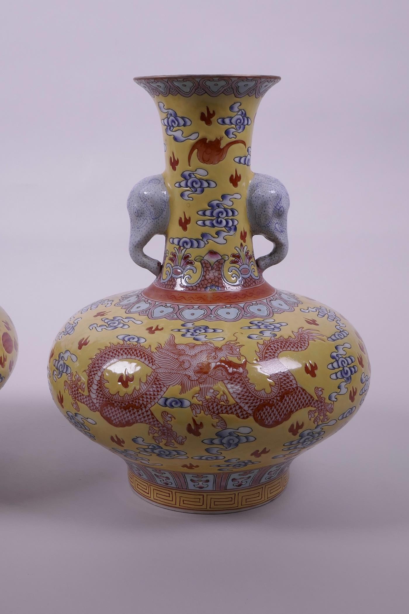 A pair of Chinese yellow ground vases with two elephant head handles and iron red dragon decoration, - Image 3 of 5