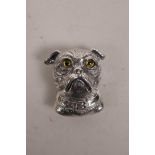 A sterling silver brooch in the form of a pug with inset glass eyes, 1"