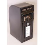 A black metal post box with cast iron front and metal shell, 23" high
