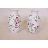 A pair of Chinese porcelain vases with nine peach decoration, one A/F, cracked and chipped, late
