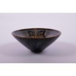 A Chinese Cizhou kiln pottery bowl of conical form with butterfly decoration, 6½" diameter