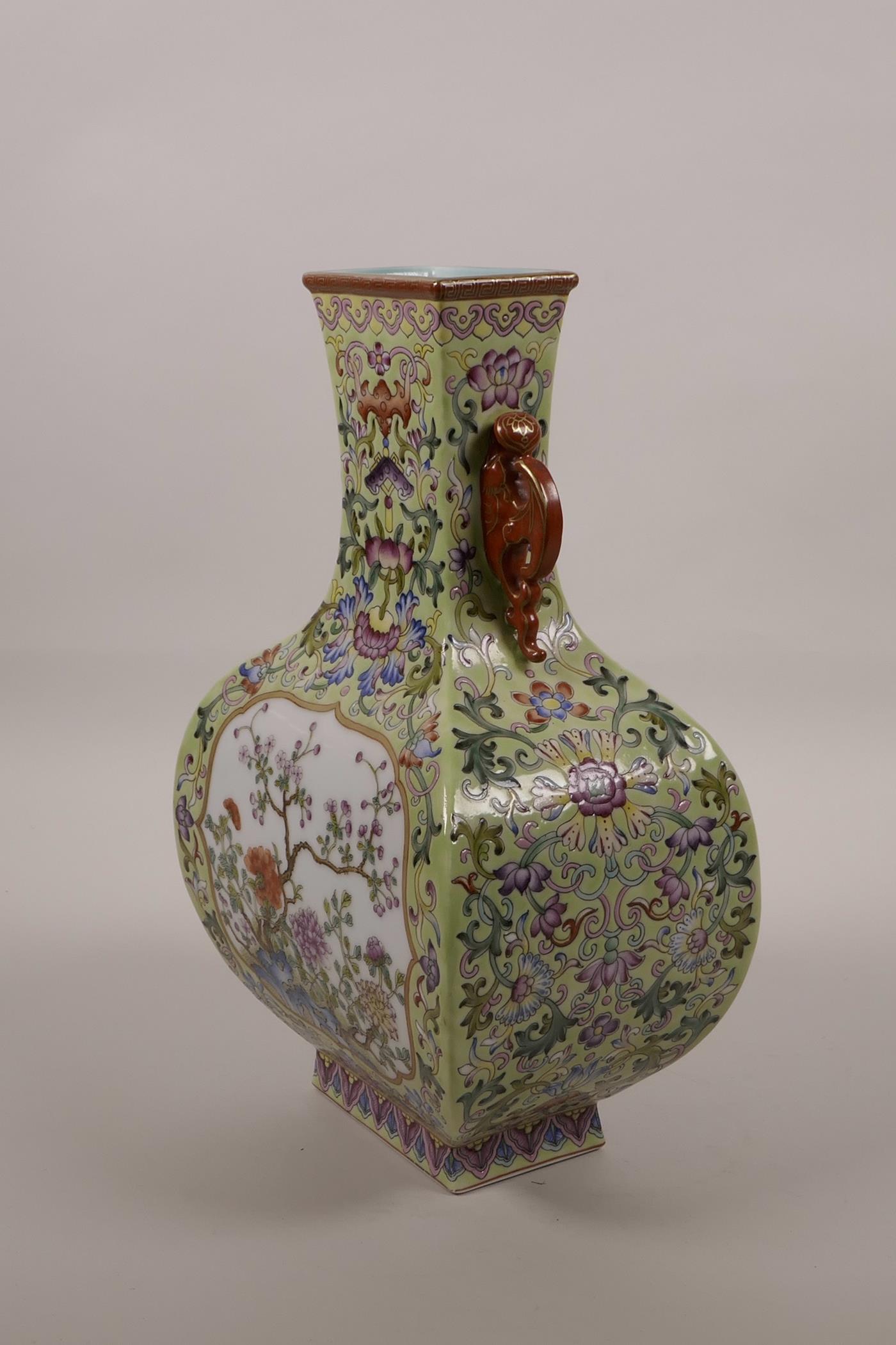 A Chinese polychrome enamelled porcelain vase with two bat shaped handles and decorative panels - Image 2 of 5