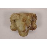 A Chinese soapstone belt hook in the form of a ram's head, 3" x 2½"