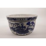 A Chinese blue and white porcelain jardiniere decorated with figures in a garden conversing and