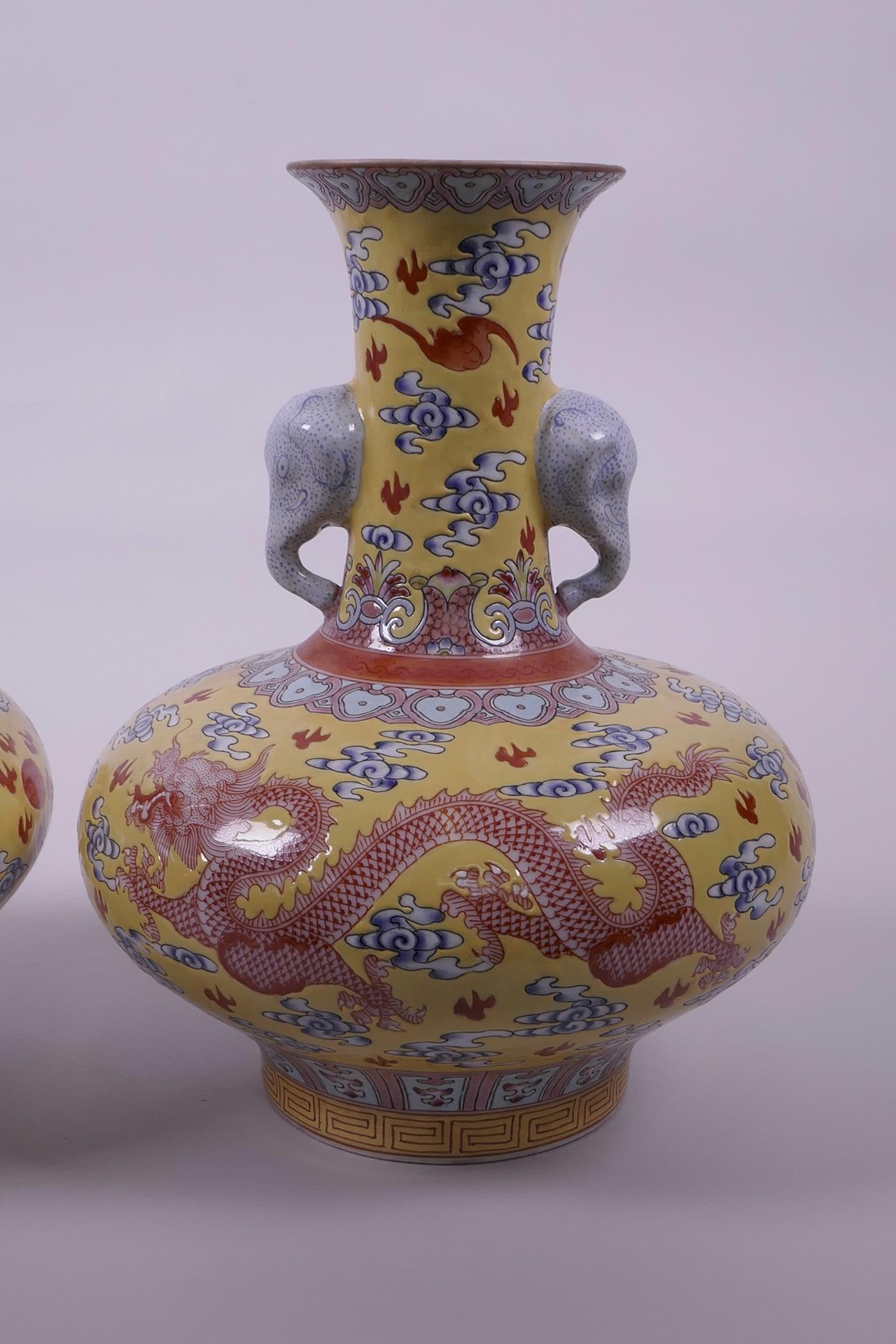 A pair of Chinese yellow ground vases with two elephant head handles and iron red dragon decoration, - Image 2 of 5