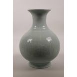 A Chinese celadon glazed porcelain pear shaped vase, 10" high