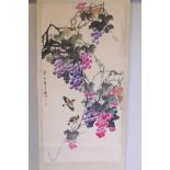 A Chinese watercolour scroll depicting birds amongst fruiting grapevines, 25½" x 51"