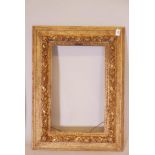 A C19th giltwood and moulded plaster picture frame, rebate 14" x 23"