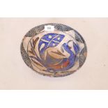 A Middle Eastern glazed terracotta bowl with phoenix decoration, 9½" diameter