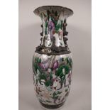 A late C19th/early C20th crackle glazed vase decorated with figures in a landscape, with bronzed