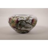 A Chinese polychrome enamelled porcelain bowl with rolled rim decorated with a fruiting peach