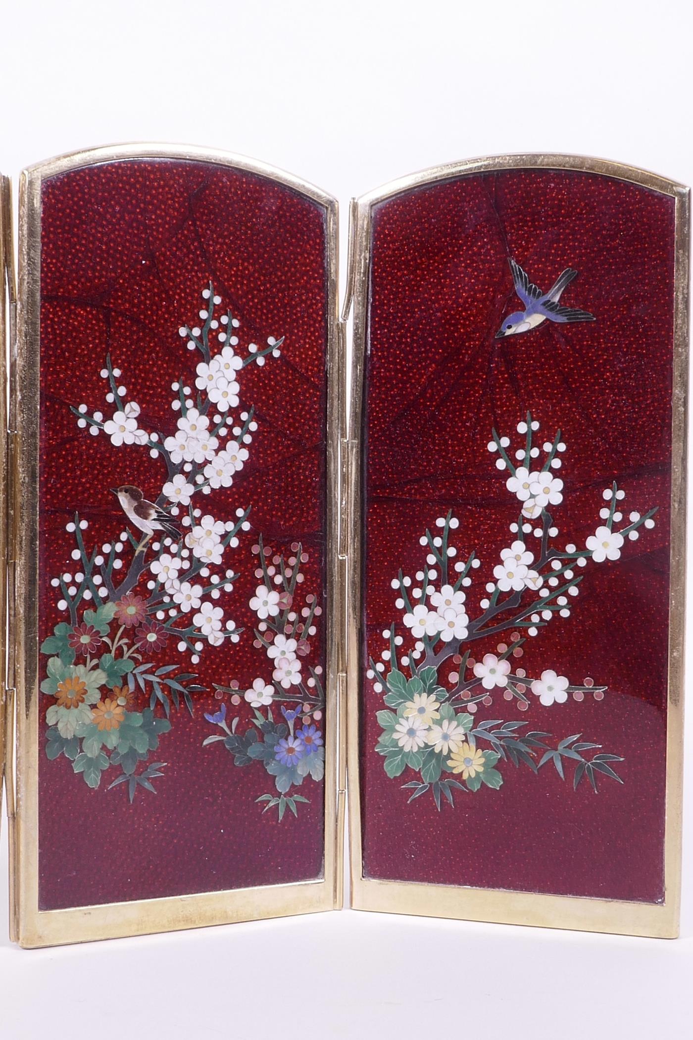 A Japanese red Ginbari cloisonné four fold table screen decorated with birds amongst prunus blossom, - Image 3 of 3