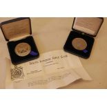 A South London Rifle Club/Sotheby's limited edition commemorative medal and another