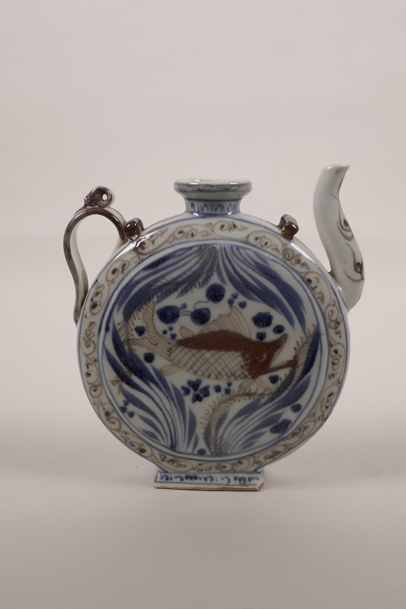 A Chinese blue and white porcelain teapot of slender form decorated with a red carp, 6½" high