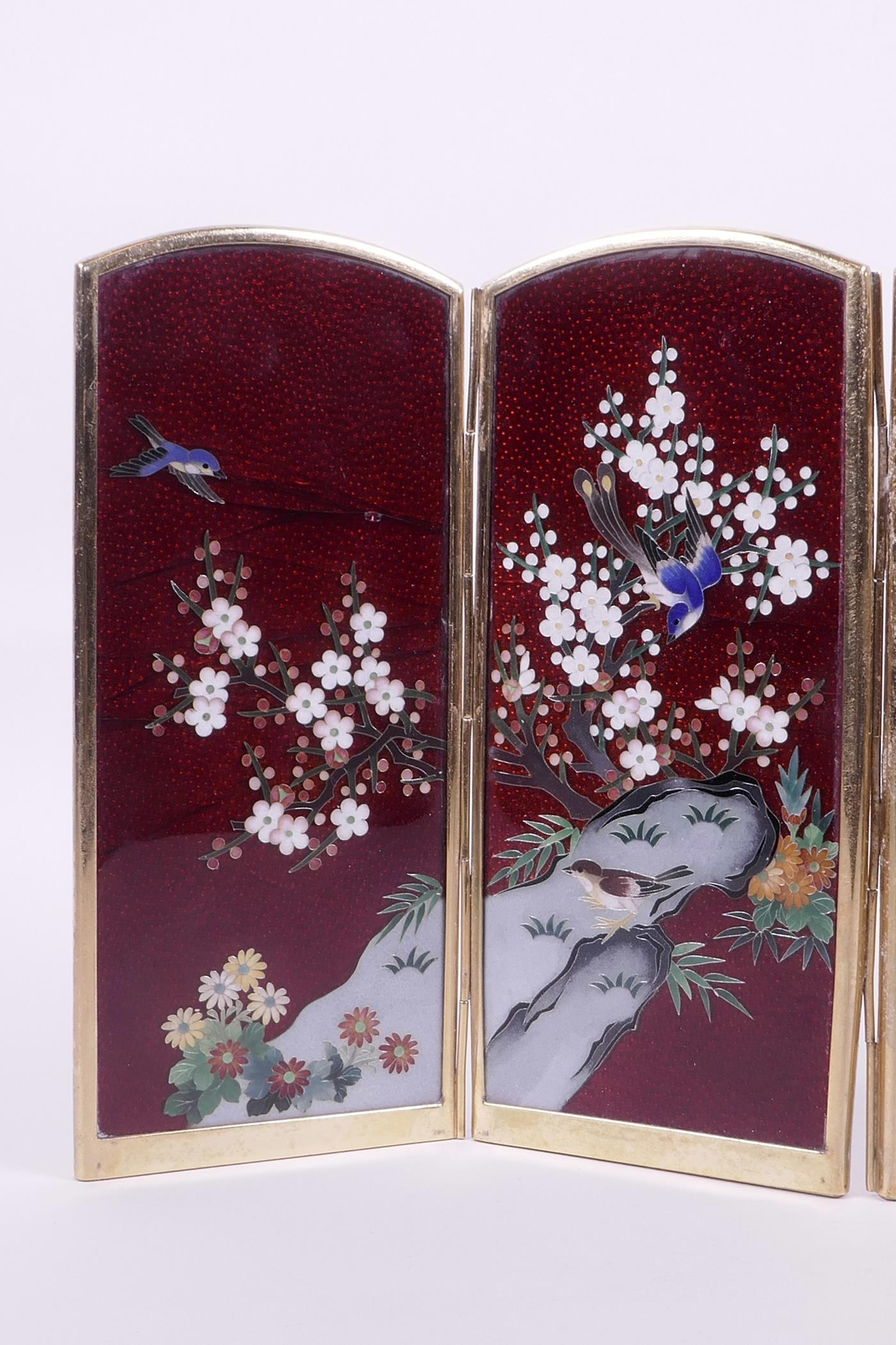 A Japanese red Ginbari cloisonné four fold table screen decorated with birds amongst prunus blossom, - Image 2 of 3