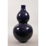A Chinese powder blue glazed porcelain double gourd vase, 6 character mark to base, 15" high