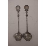 A Chinese silvered metal coin spoon and another similar, marked to the reverse, 7"