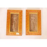 A pair of porcelain panels, painted with Edwardian beauties, in maple frames, 15" x 9"