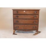 A George III mahogany chest of four graduated drawers, with cockbeaded decoration and original