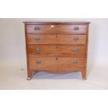 A George III inlaid mahogany chest of four graduated long drawers, with brass plate handles and
